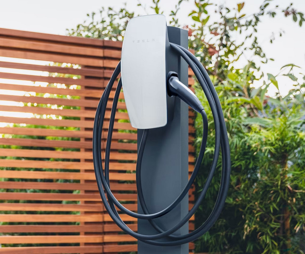 Telsa gen 3 wall connector mounted on  pedestal  outdoors